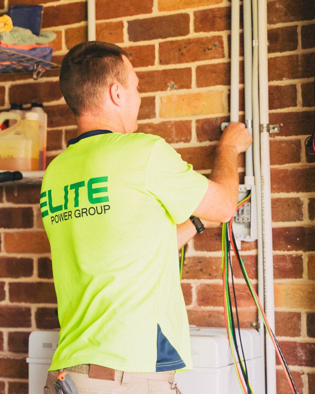 An electrician installing wiring during a home renovation